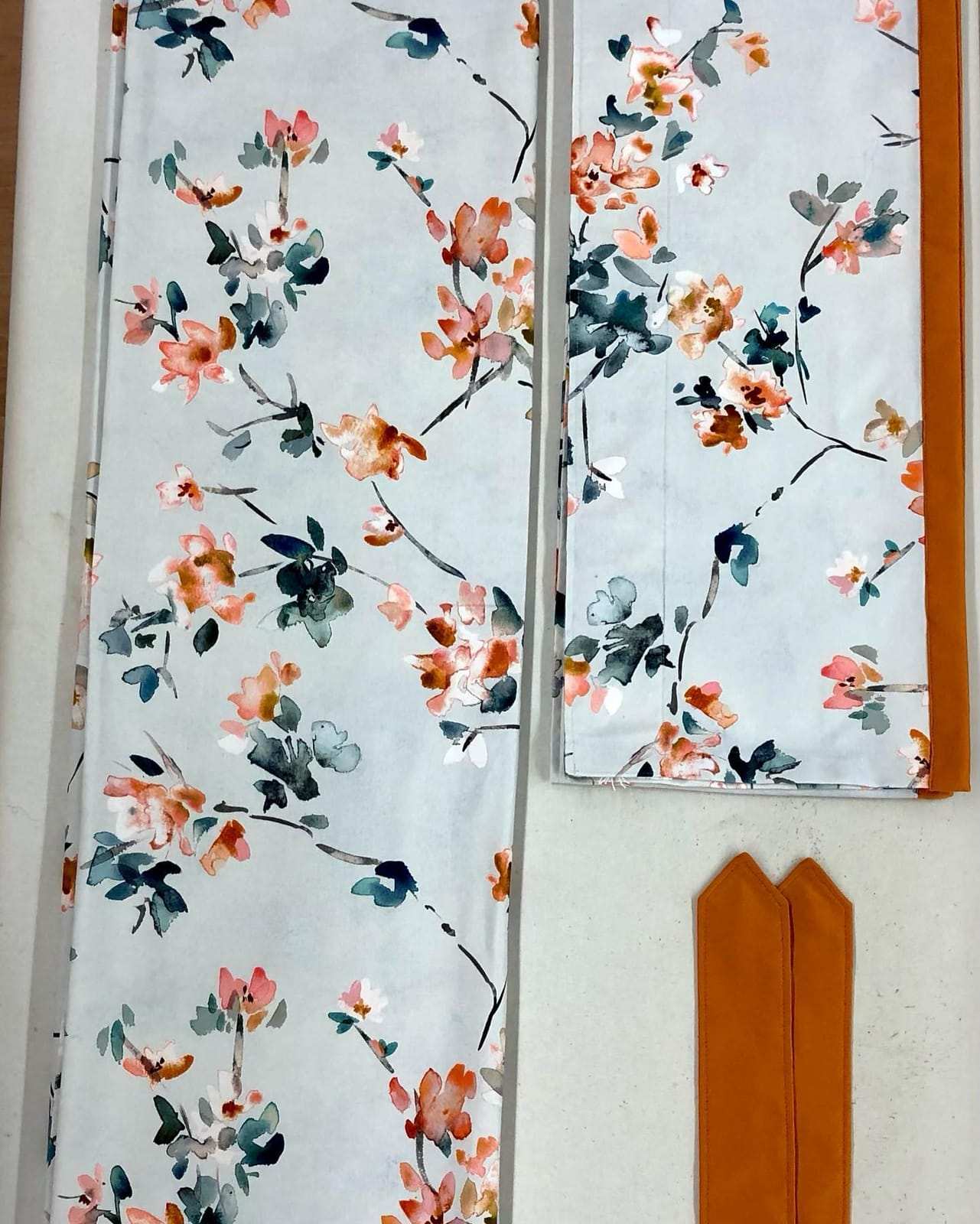 Curtains and a valance in a floral fabric with matching tie-backs