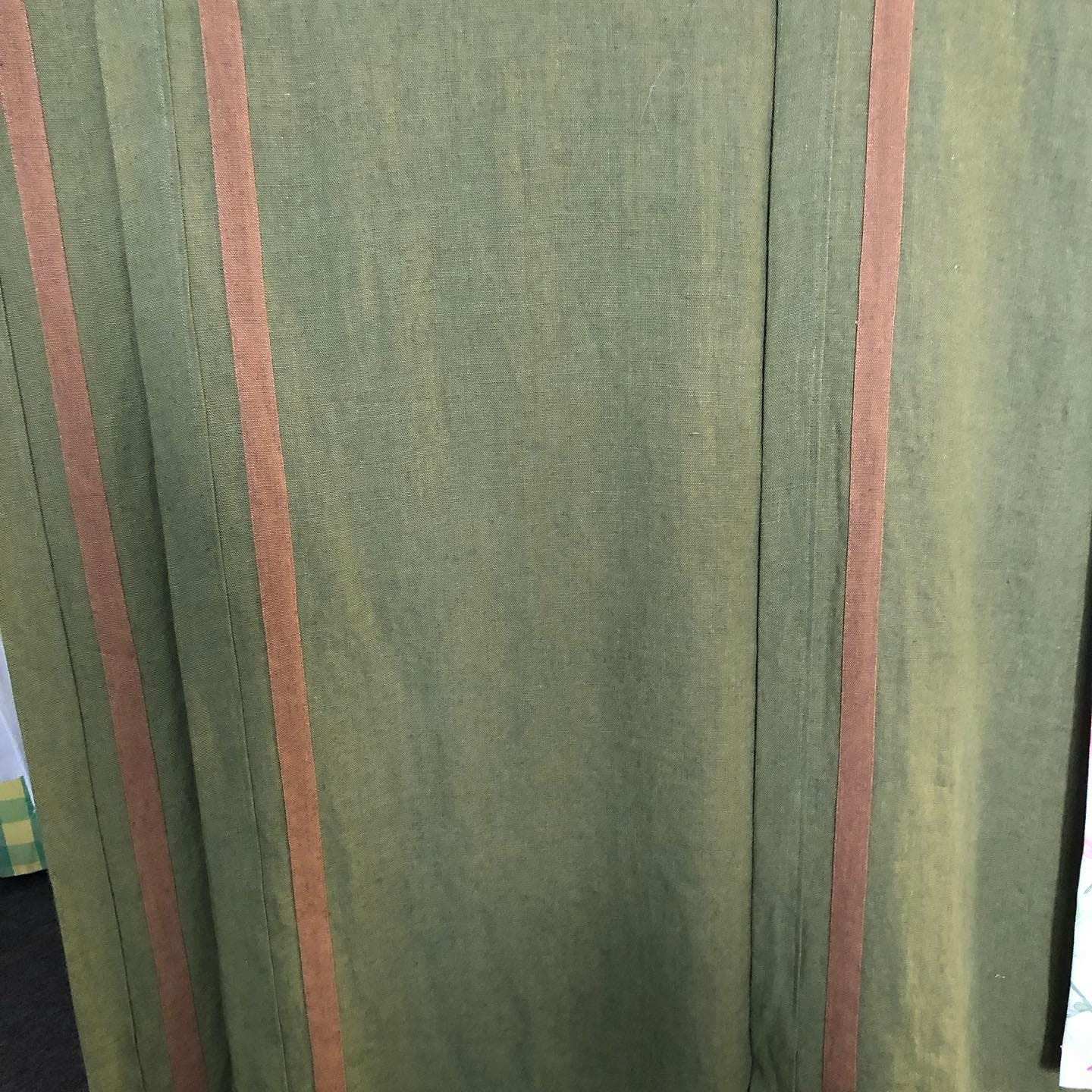 Linen drapes, edges folded over and finished with stripes